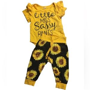 Two sets of infant girl outfits